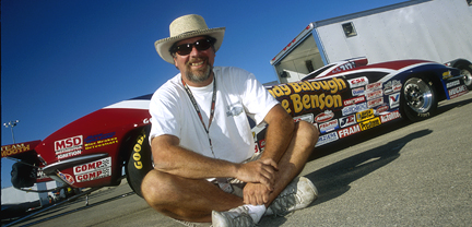 Nat. Dragster shot of R.B. with Vette at Indy.