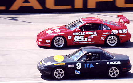 Passing a Miata on the front straight.