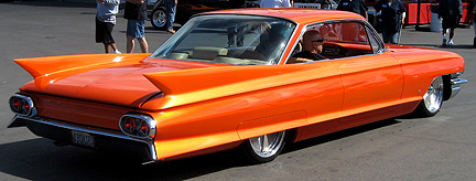 Long, low orange Caddy.