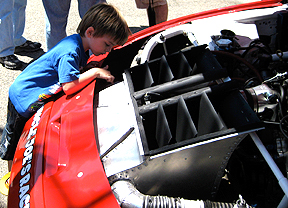 Little kid checking out the engine.