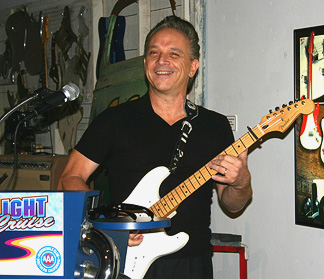 Jimmie Vaughan playing a song.