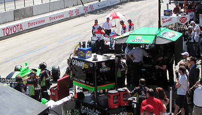 Wide shot of pit lane.