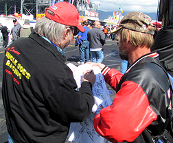 Signing a shirt.